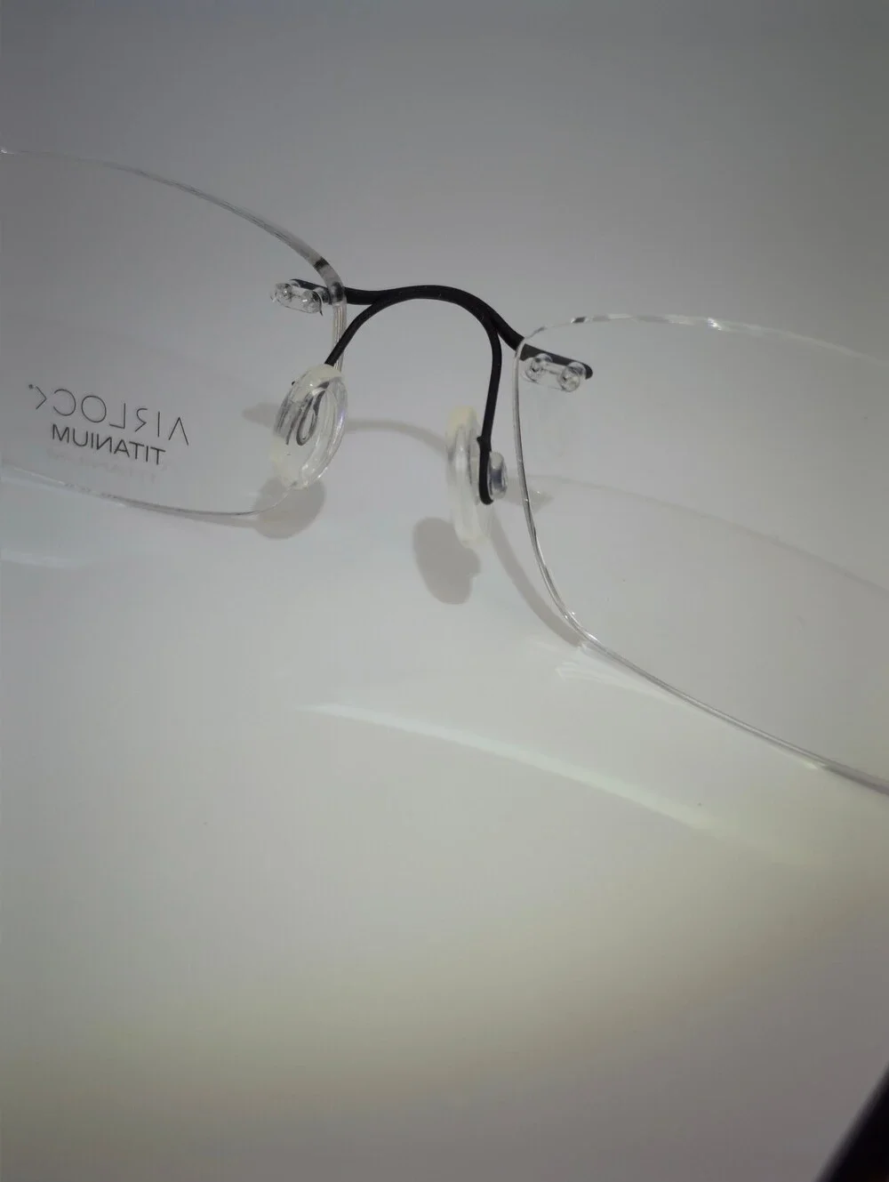 Airlock Titanium. Rimless Compression Mount. Patterns Mounting Bushing Inc.